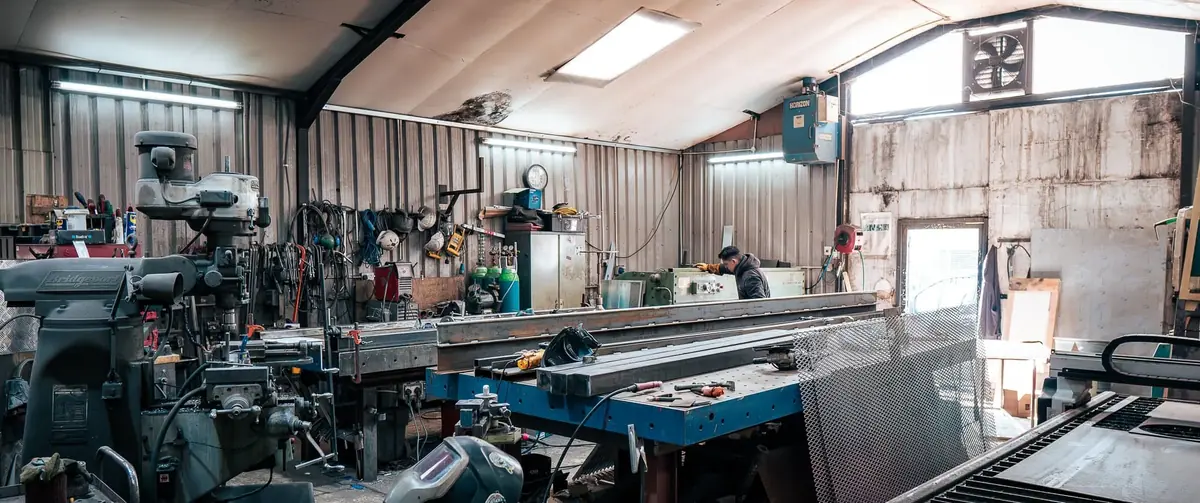 Partner metal workshop with milling machines and steel benches for bespoke metalwork and architectural fabrication