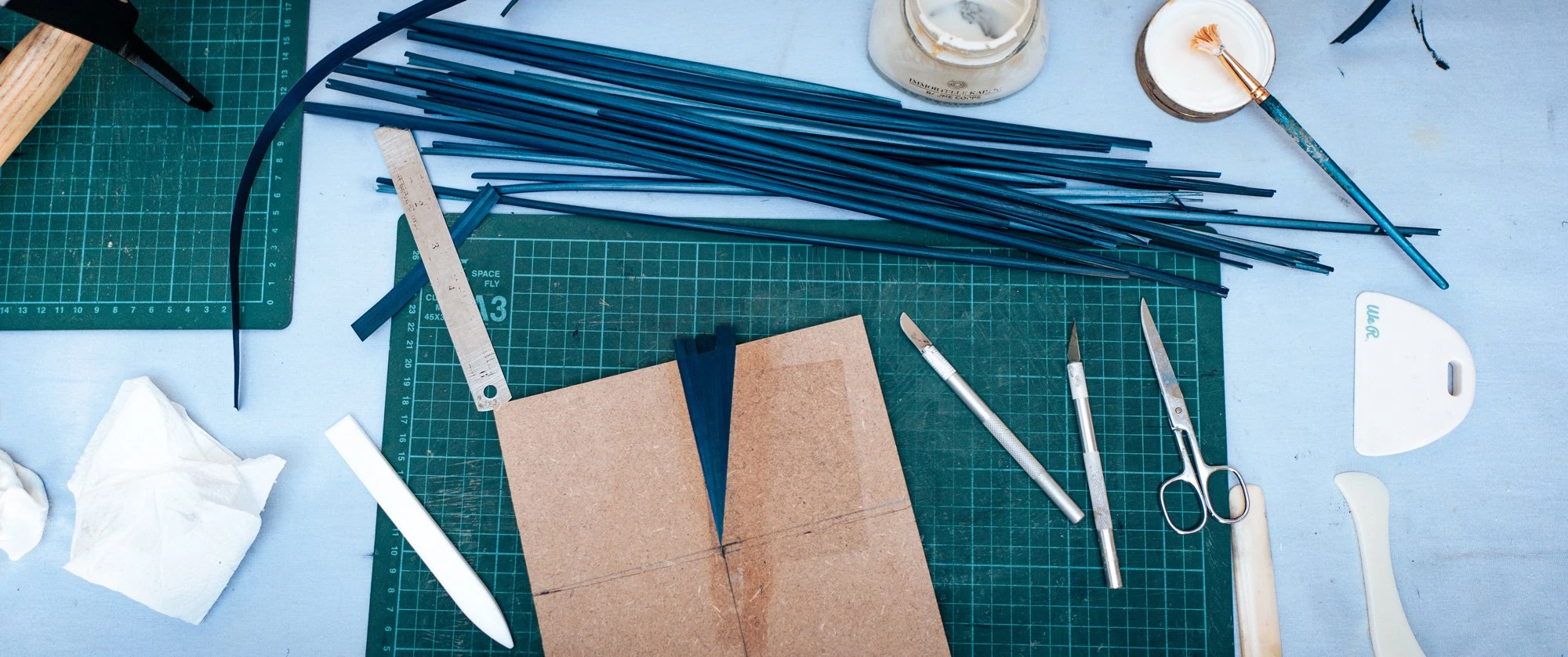 Straw Marquetry Artist At Work with Cutting Board