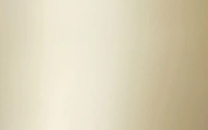 Satin champagne-gold steel sheet with soft light gradient, PVD coated metal finish