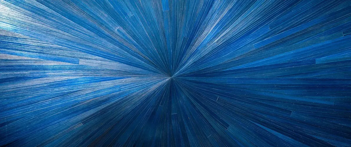 Blue dyed straw marquetry in a radiating sunburst pattern, handmade decorative surface