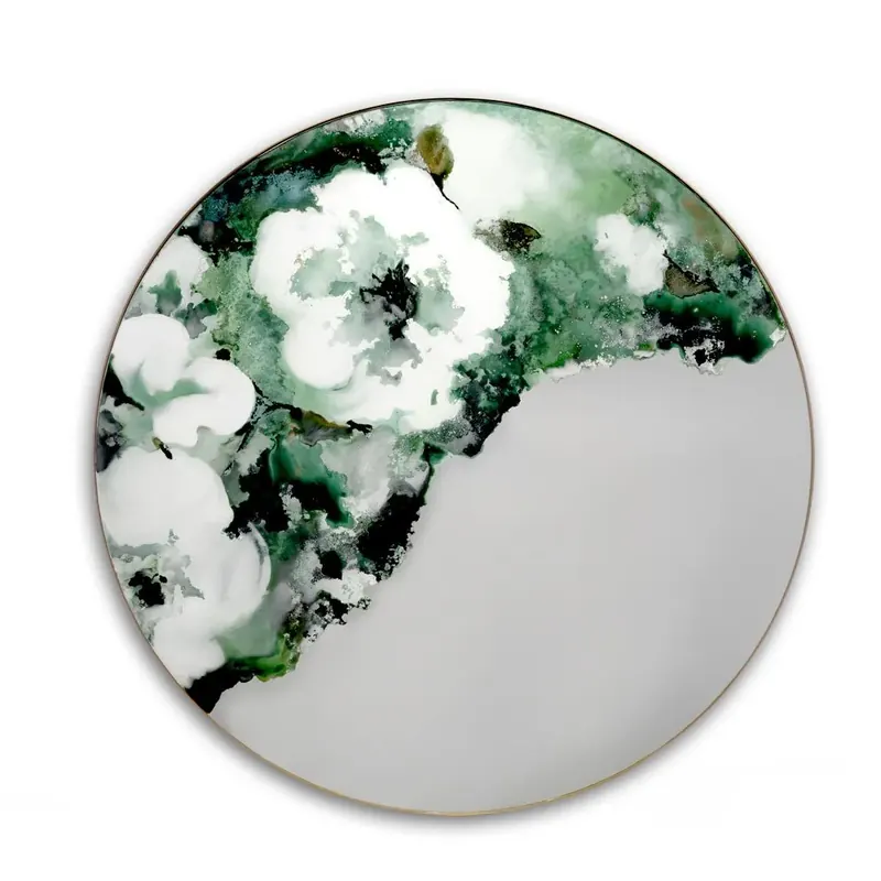 Round verre églomisé mirror with painted white and green flowers on a pale grey glass ground