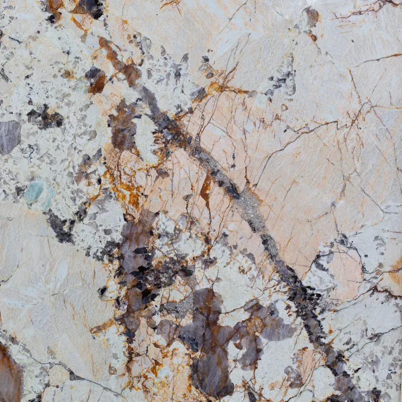 Patagonia quartzite slab, cream stone with bold dark brown and amber veining, a natural stone for worktops