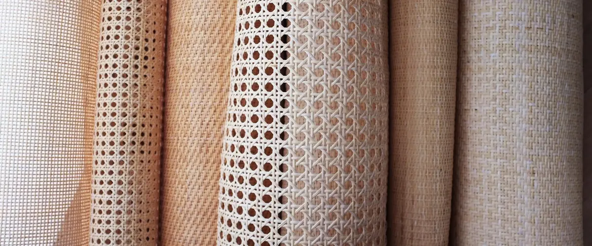 Rolls of natural rattan and cane webbing in open and tight weaves