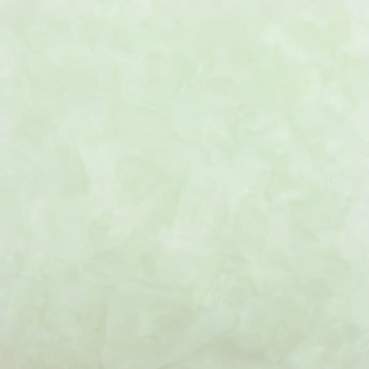 Pale green pearloid acrylic with soft marbled swirls, decorative finish sample