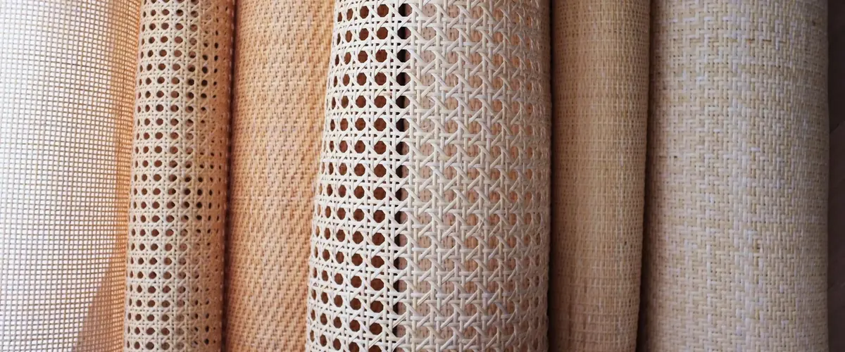 Rolls of natural rattan and cane webbing sheets in varied weaves