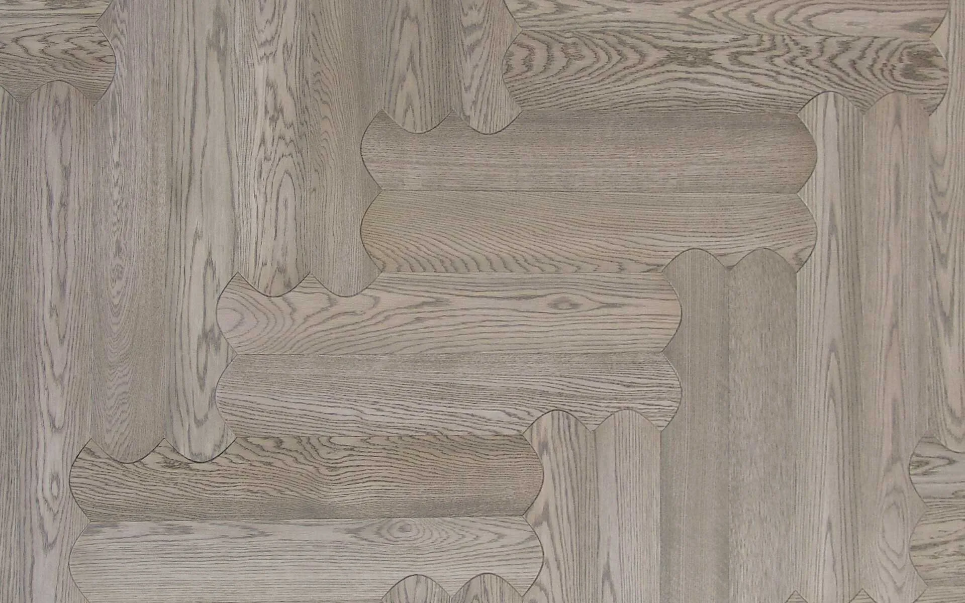 Oak Pienza 1458 in the Biscuit interlocking pattern, a neutral grey-beige oak