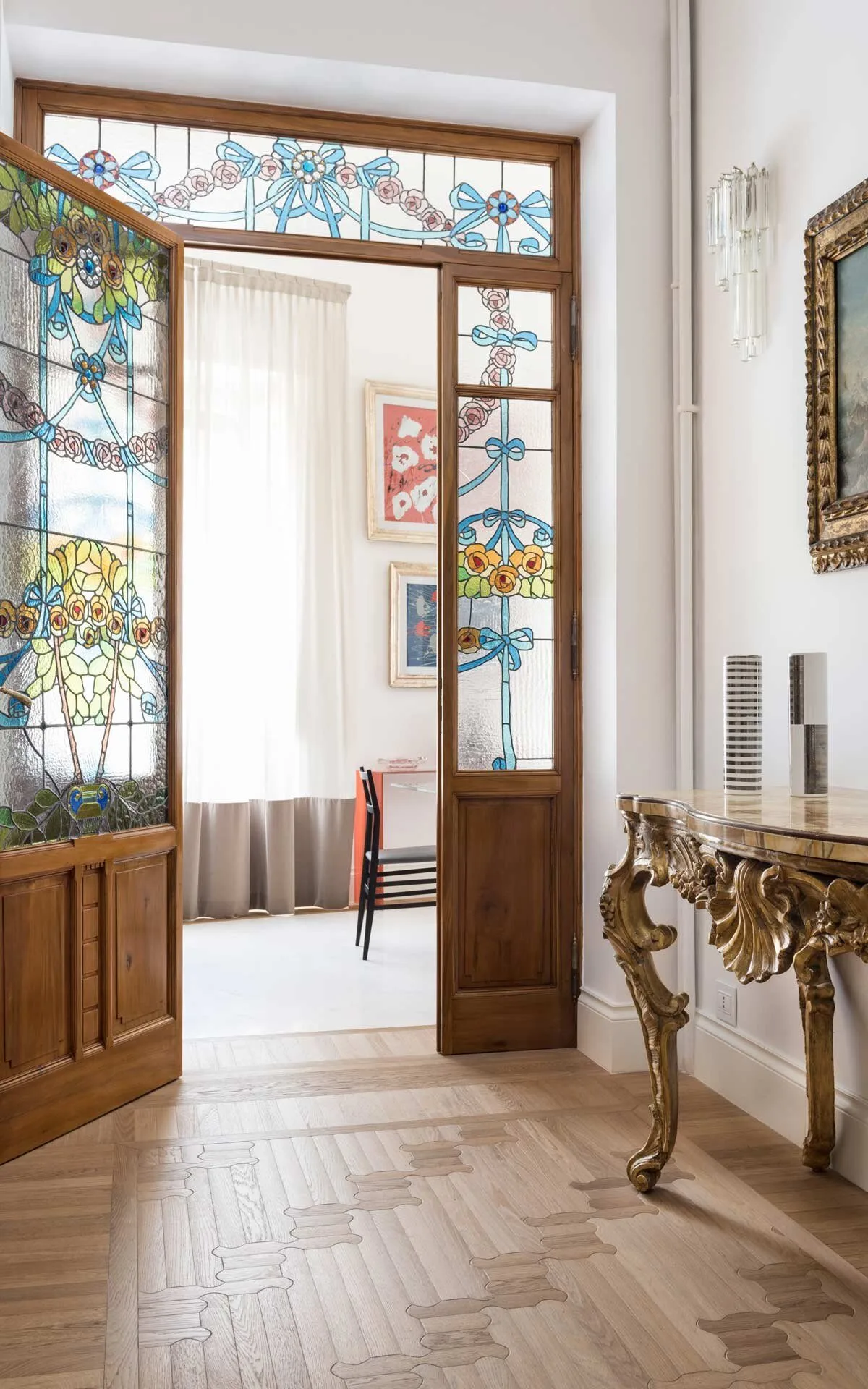 Biscuit oak floor in a hallway beside a stained-glass door, laid with interlocking rounded boards