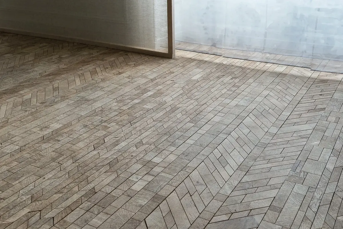 Herringbone timber floor in a muted grey-brown tone, bespoke flooring