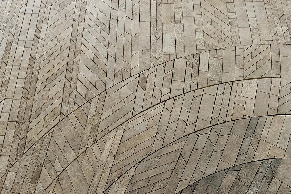 Forêt Rosace: curved bands of end-grain oak blocks laid in a radial herringbone