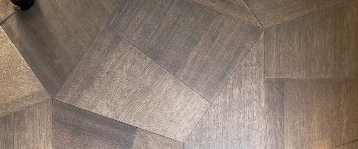 Slide collection dark oak flooring in angular trapezoid modules