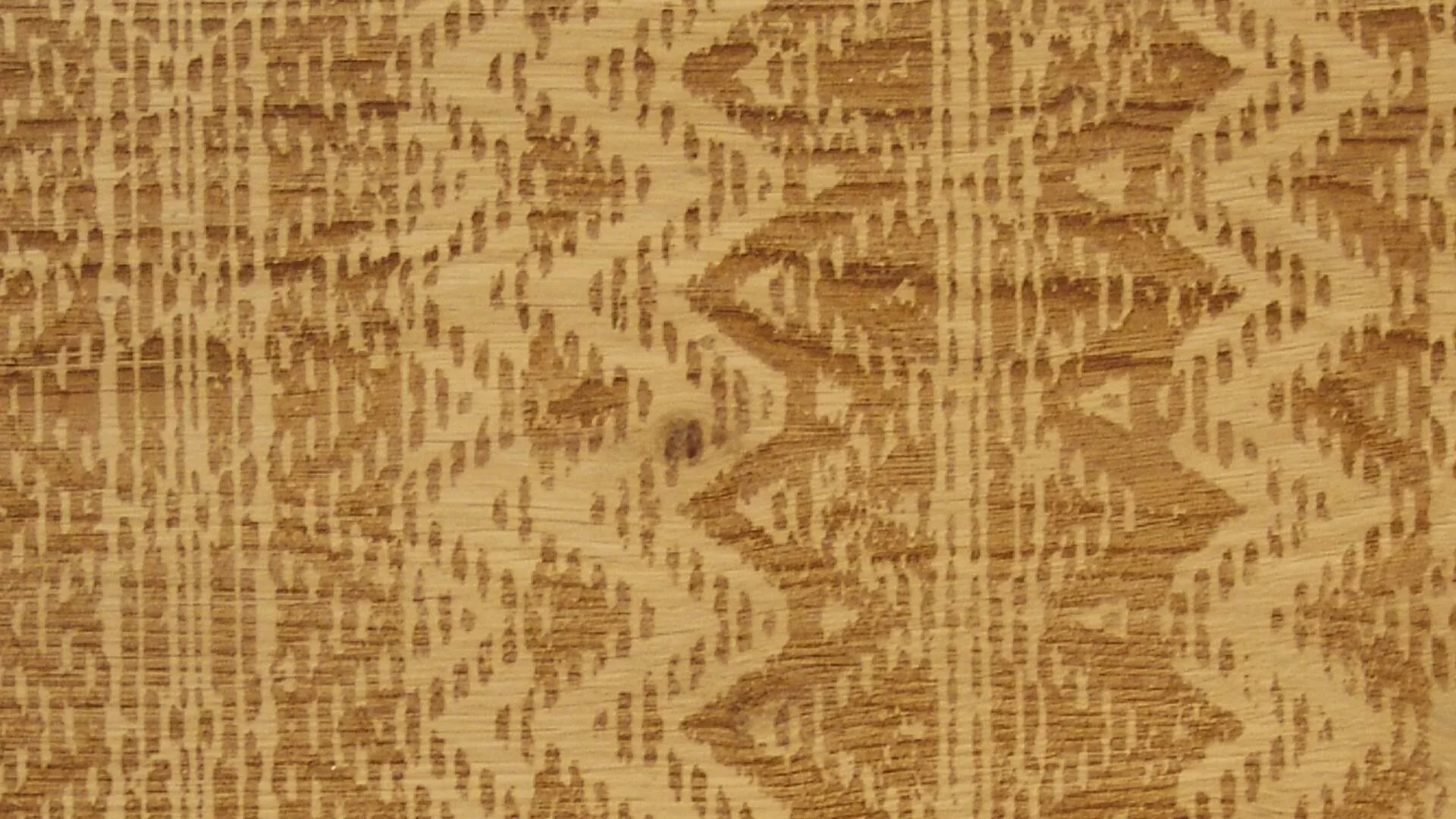 Undici oak flooring with a zigzag stripe pattern engraved in amber on pale oak