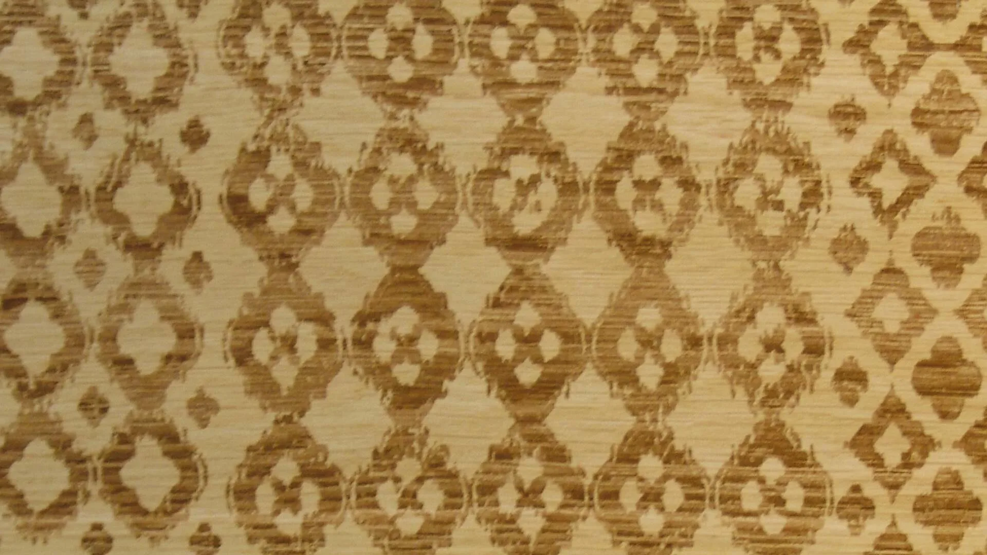 Undici oak flooring with a lattice of rounded diamonds engraved in amber on pale oak