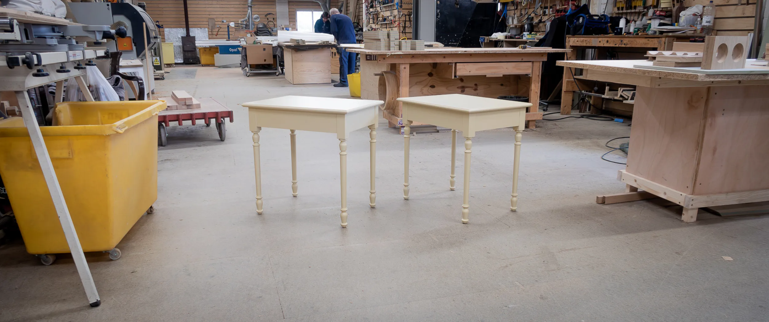 The pair of side tables finished in a pale oil-based ground, turned legs and clean tops, ready to be sent on for hand-painting.