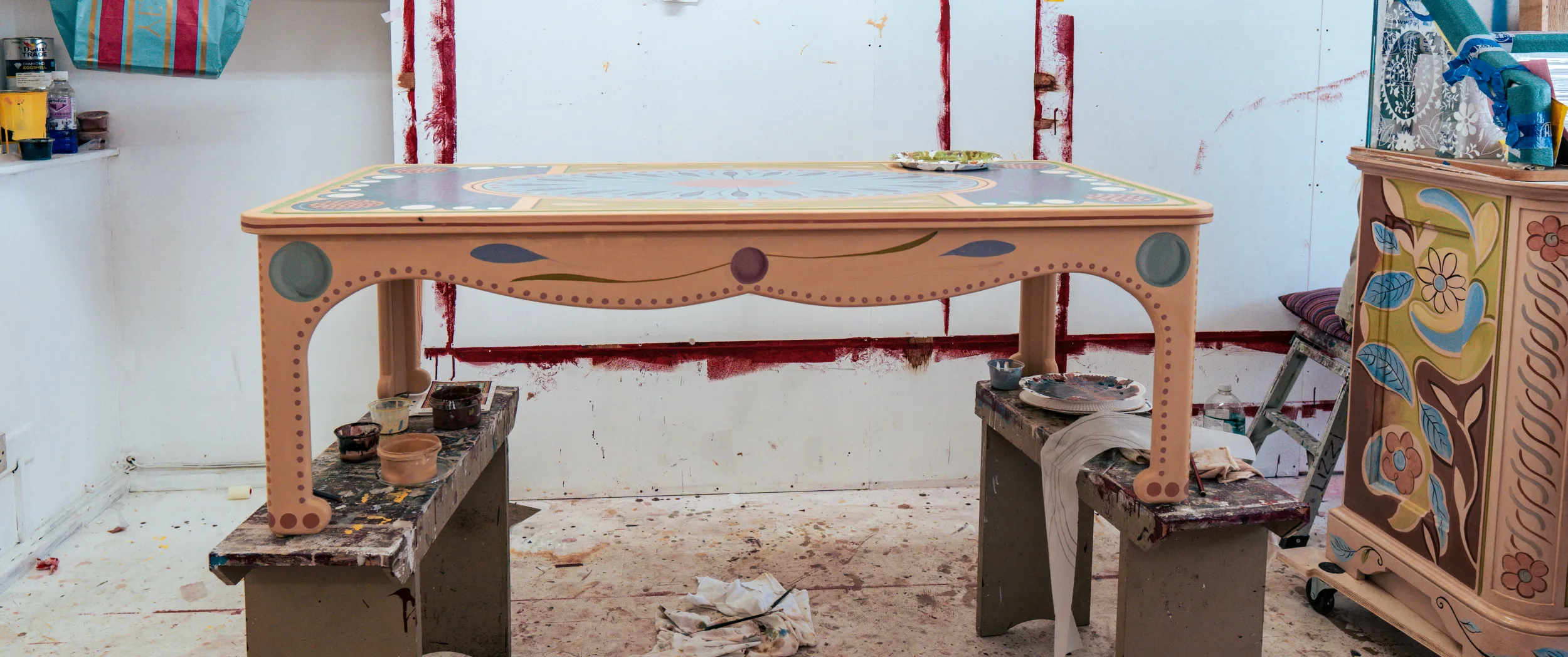 A finished hand-painted low table in the artist's studio.