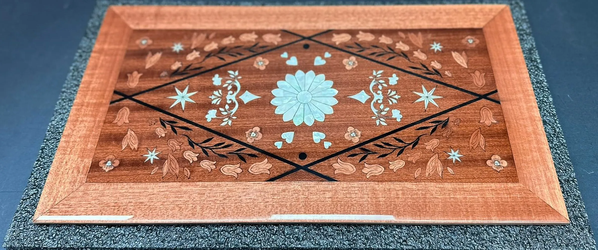 Pommele Sapele figure under gloss finish