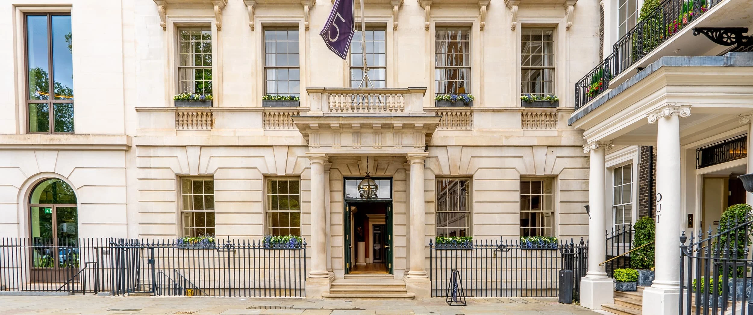Exterior view focusing on the central bay and railings of 5 St James's Square, emphasising the dignified architecture that frames the calm, residential-style bespoke office interiors inside.